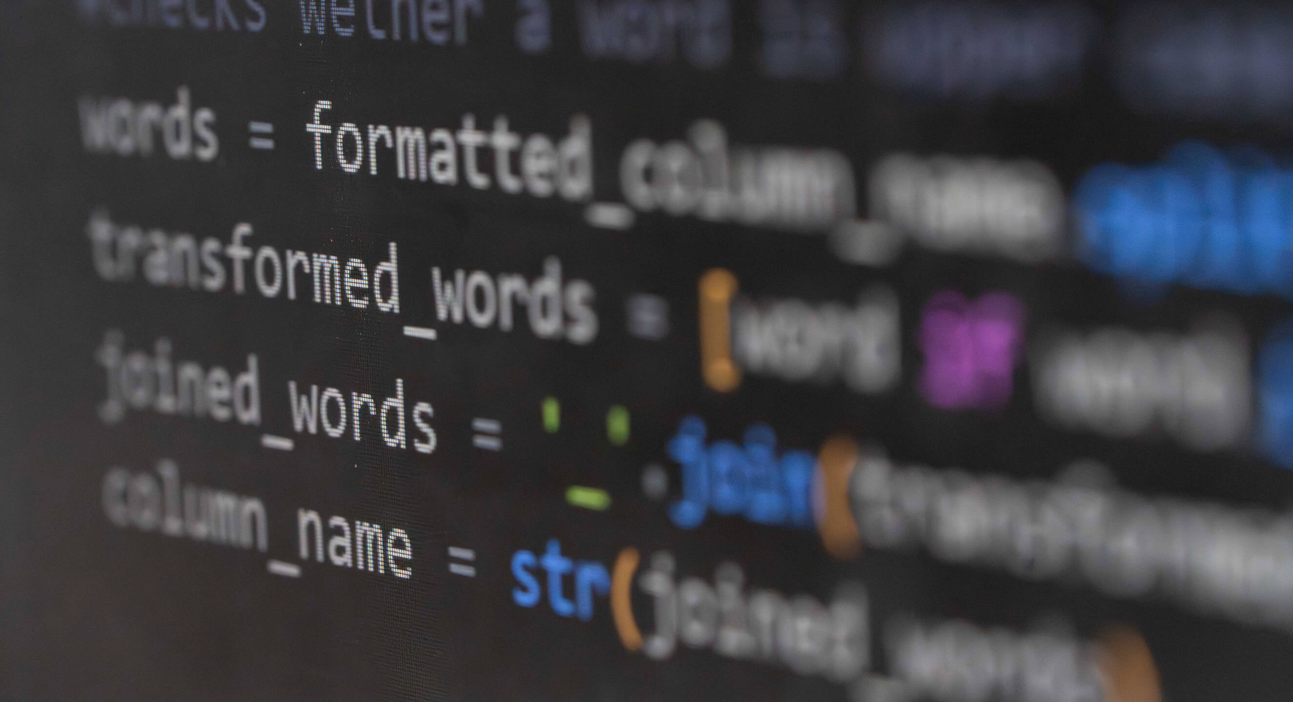 A close-up of a monitor displaying computer code