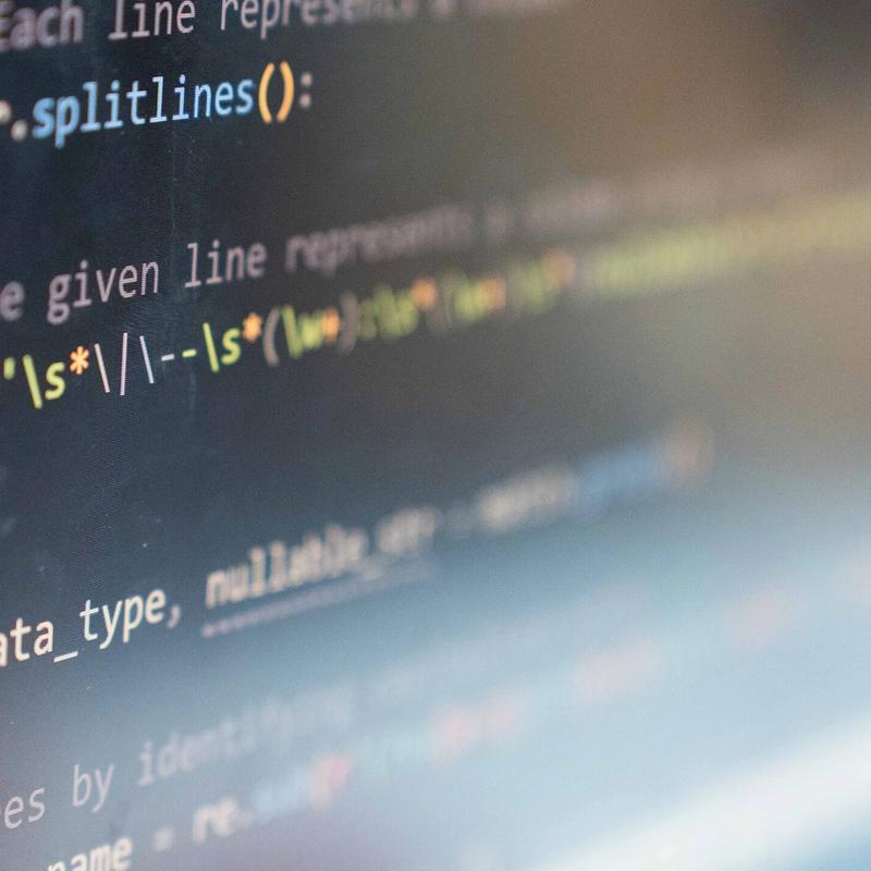 A close-up of a monitor displaying computer code