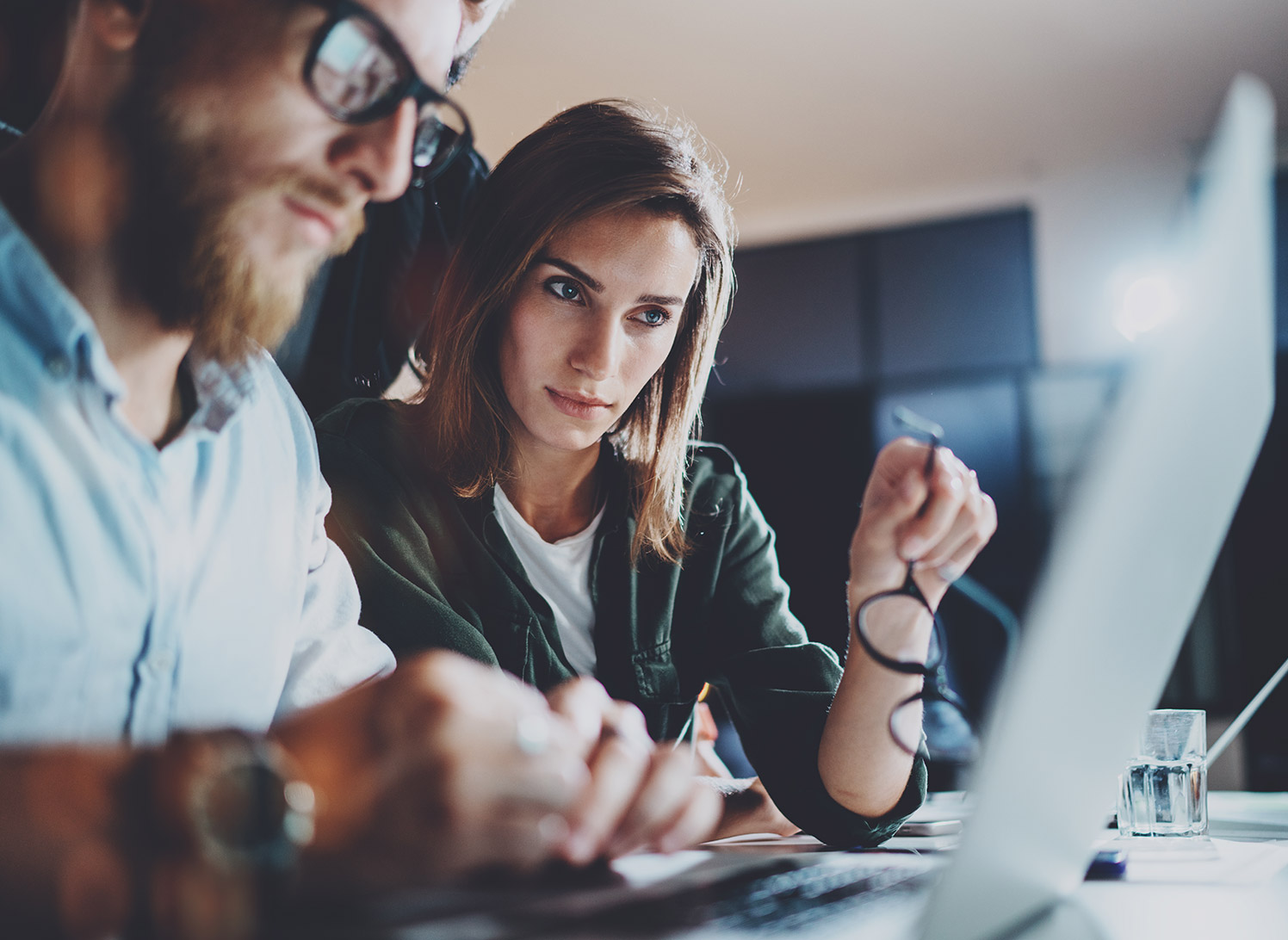 Man and woman reviewing information security in power BI