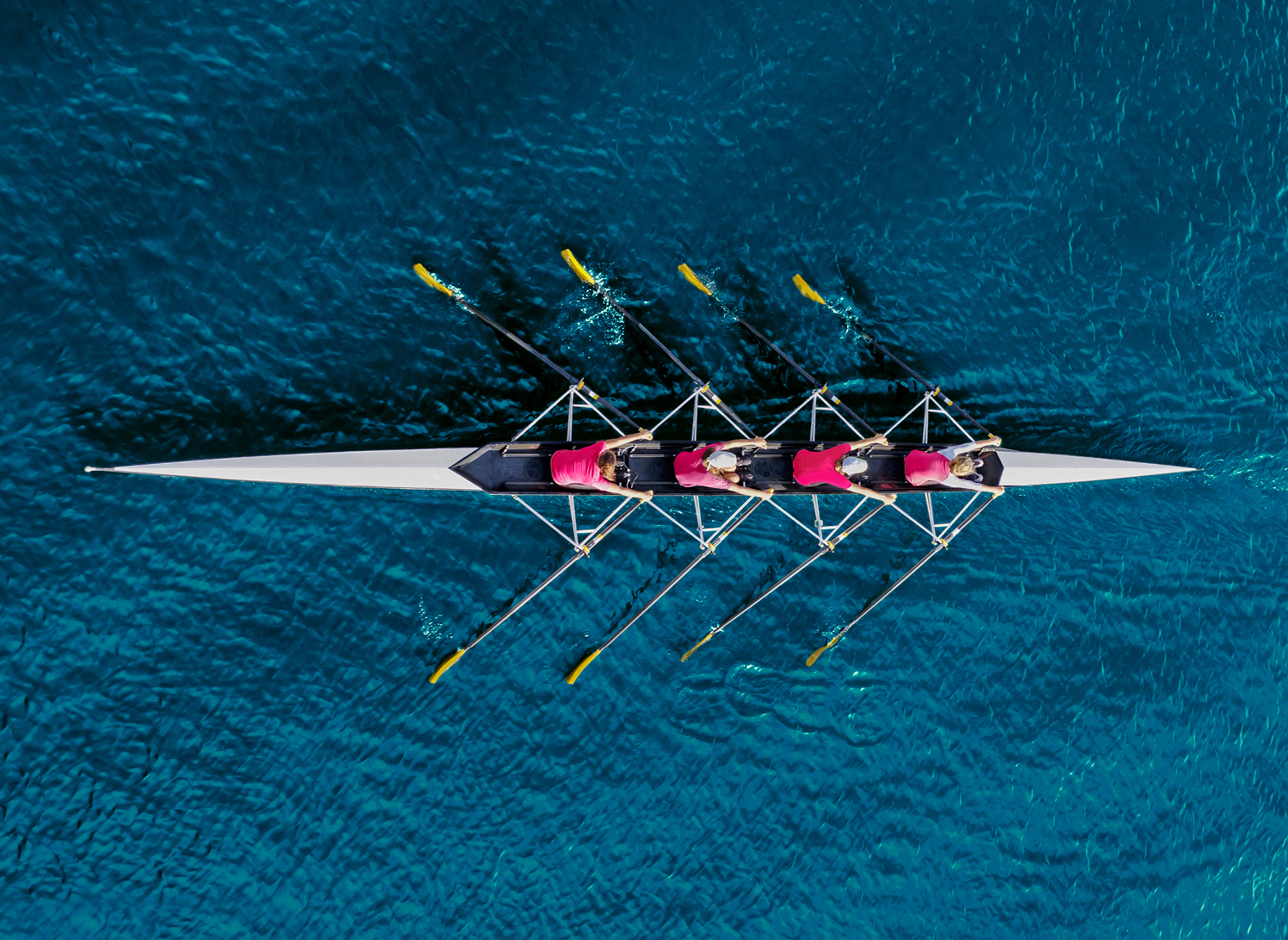 Enabling your employees image of people rowing