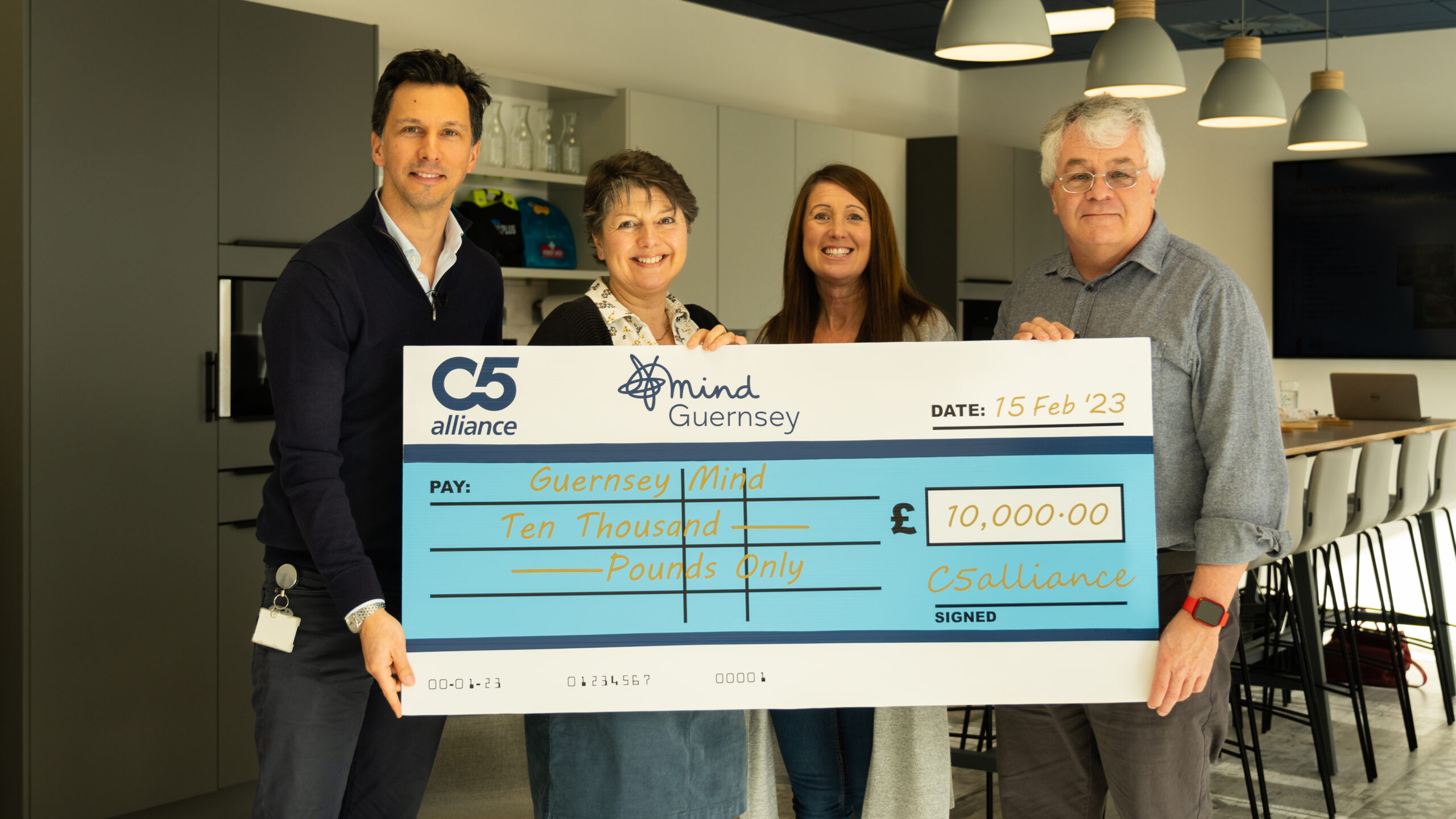 Handing over cheque to Guernsey Mind